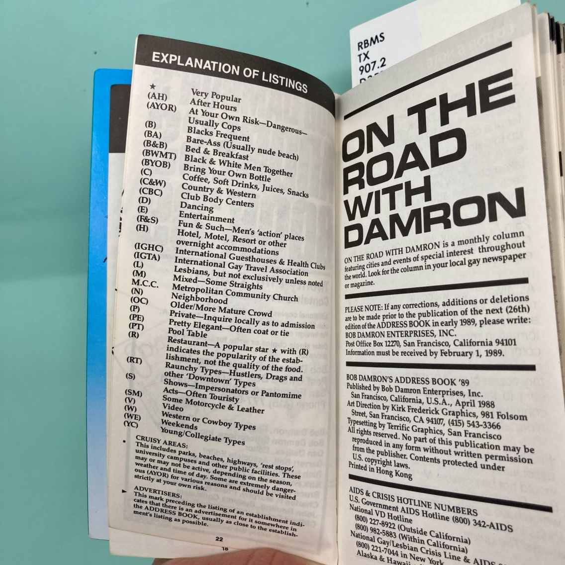 introductory pages of 1989 Damron guide with a list of explanations of acronyms for listings such as "AH After Hours," "W Western or Cowboy Types" 