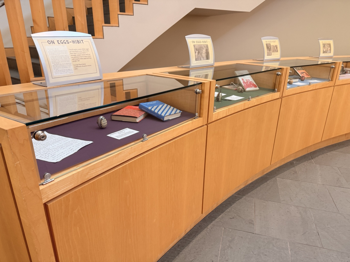 Photo of curved waist high display cases, viewable from top and front