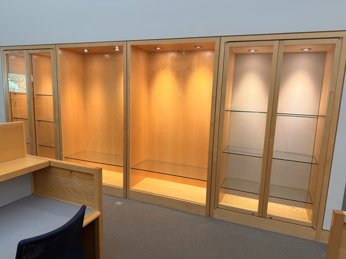 Photo of empty display case and shelves