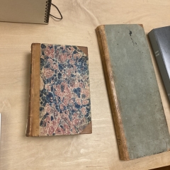 two books on a wooden table