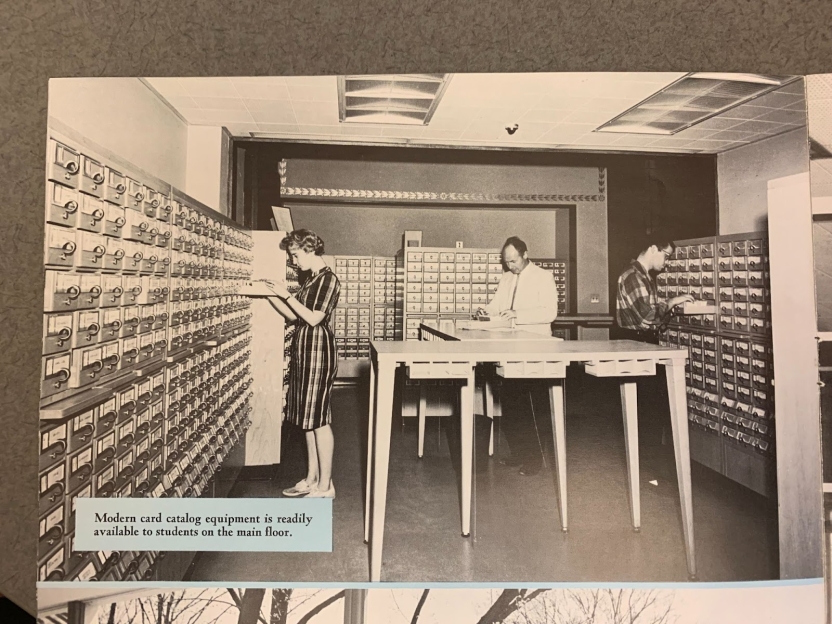 students sorting through a card catalog