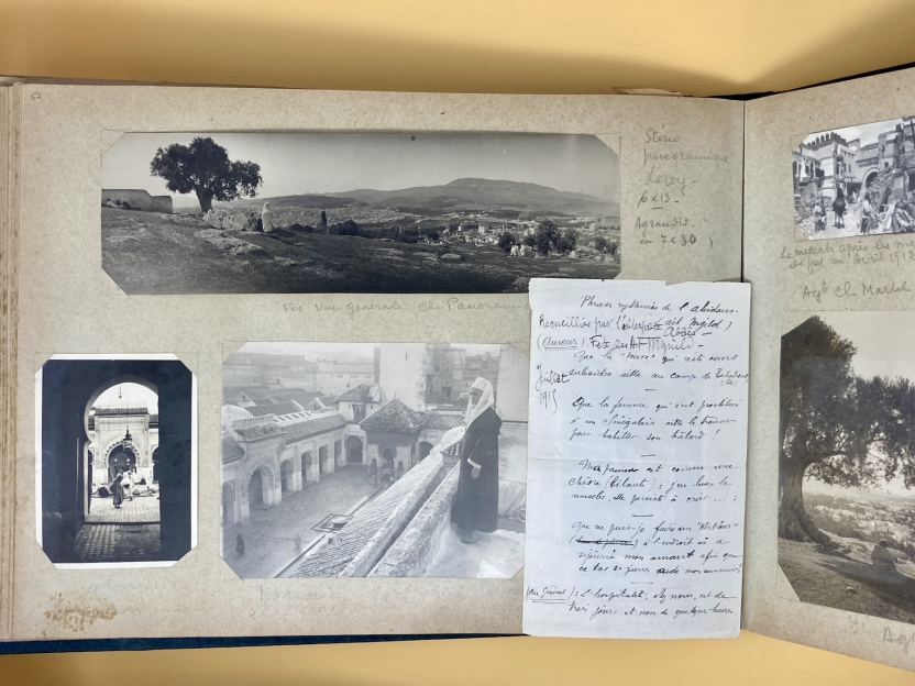 Photo album page with panorama photo of Fez, a figure under an arch, and a person on a balcony