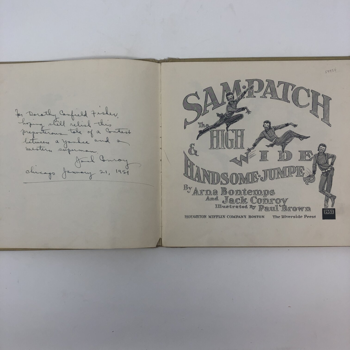 Photograph of the title page of Sam Patch by Arna Bontemps. The title page features illustrations of two high-jumping figures and one figure standing on a platform reading "1951." On the opposite page is a handwritten note that reads: "For Dorothy Canfield Fisher, hoping she'll relish this preposterous tale of a contest between a yankee and a western superman. Jack Conroy, Chicago January 21, 1951."
