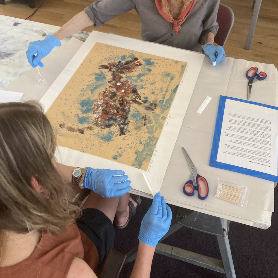 Volunteers restore flood damaged art prints
