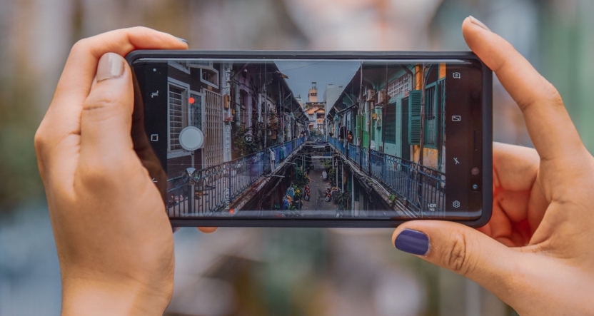 Phone camera taking a photo of an urban street scene