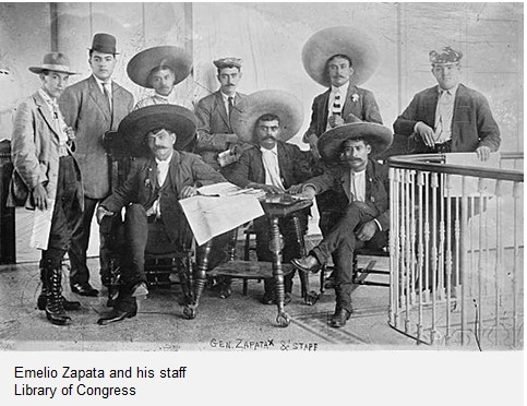 Group of seated and standing Mexican men circa 1910-1920