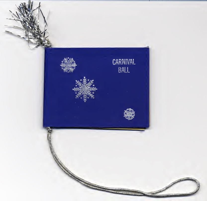 blue card with silver snowflakes and words "carnival ball" printed on cover, with silver cord and fringe 