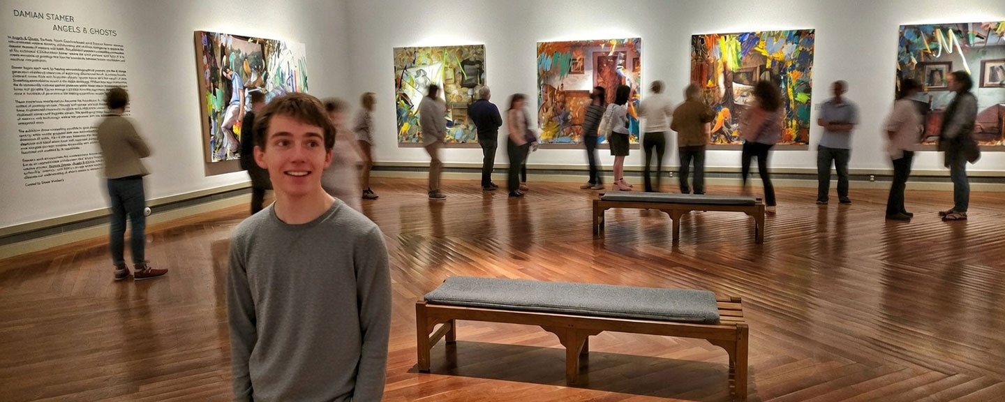 people viewing a contemporary art exhibit in a gallery