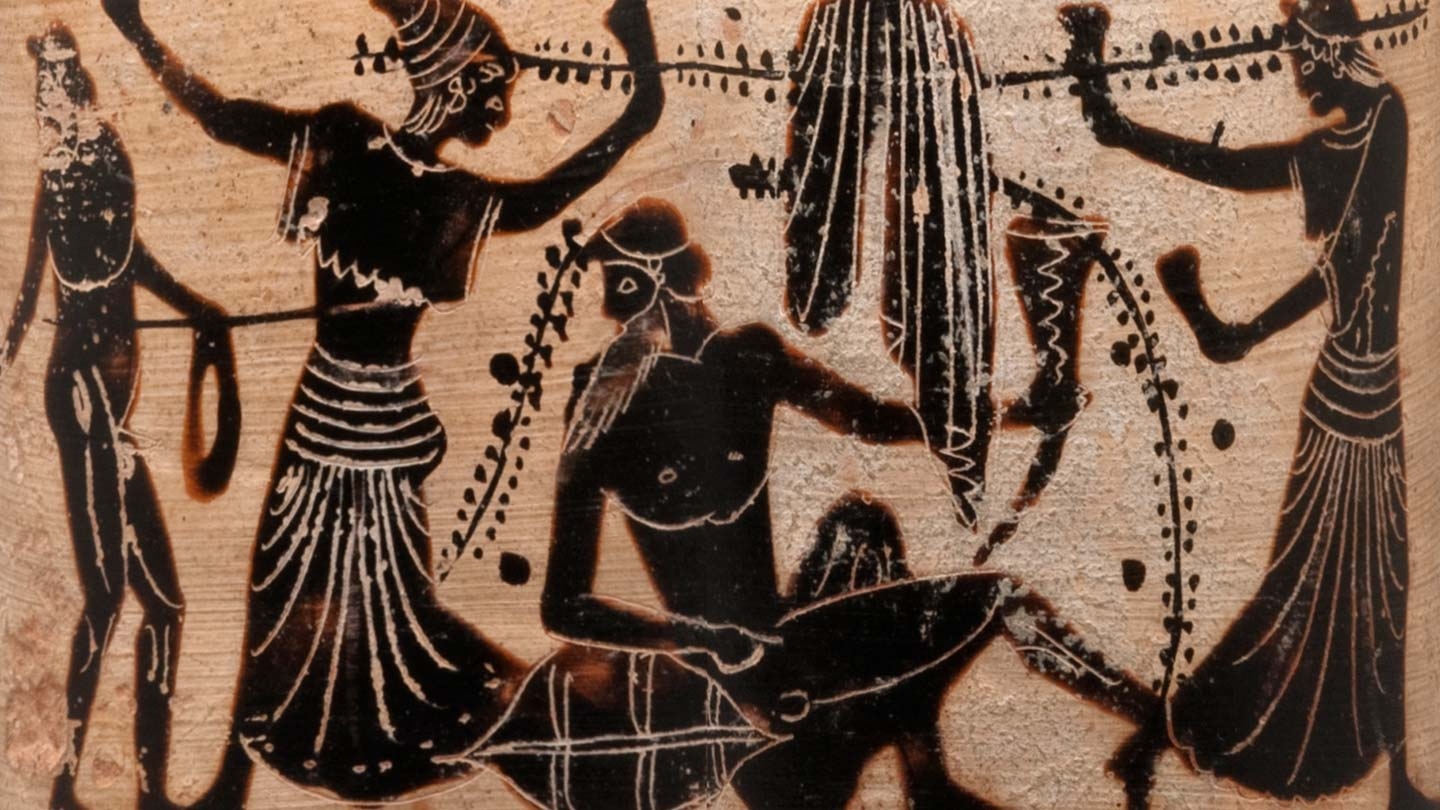 detail of a group of revelers on a white ground vase