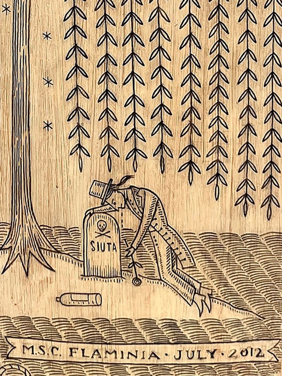 detail of recylced bottle with scrimshaw style art