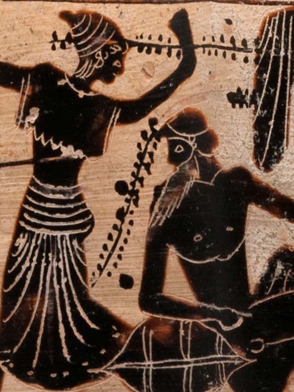 detail of black-figure revelers on a white-ground vase