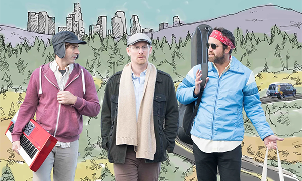 three bandmates carrying instruments while walking and talking, with an illustrated road-scape behind them