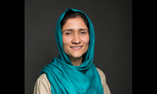 Shabana Basij-Rasikh, in turquoise headscarf and khaki top