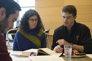 Rabbi Danielle studies the weekly Torah portion with students during a Friday “Lunch and Learn.”