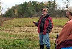 Professor Emeritus of biology and environmental studies Steve Trombulak describes features of the Nature Sanctuary during a hike in October 2022.