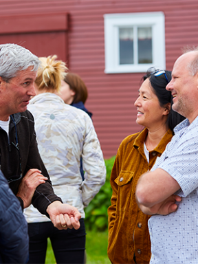 Parents socialize at a reception at Hadley Barn during Fall Family Weekend.