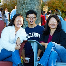 Three Midd Students sit outside during Fall Family Weekend