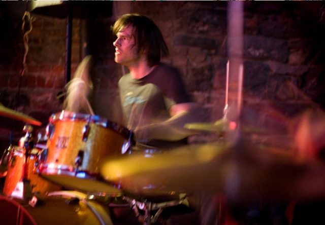 John Colpitts playing drums