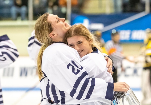 Two Middlebury Women Hockey Players Hug After Winning the Championship