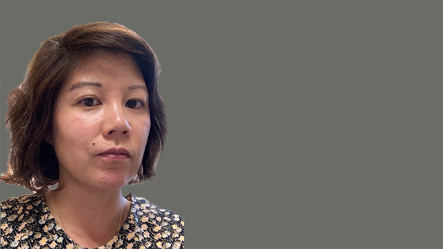 Joyce Mao in floral pattern blouse