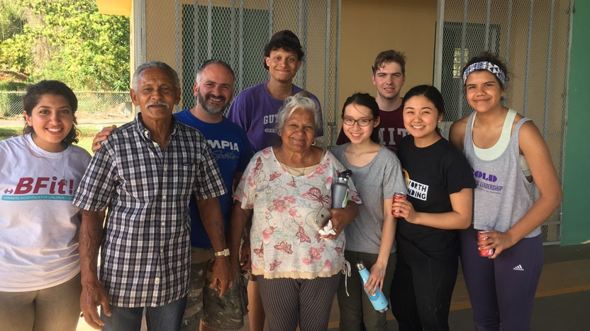 Members of the InterVarsity Christian Fellowship group pose with Puerto Ricans they assisted after a hurricane.