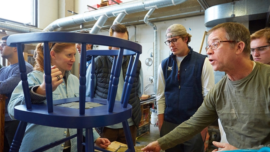 Assistant Professor Ellery Foutch oversees the reconstruction of a relic chair.