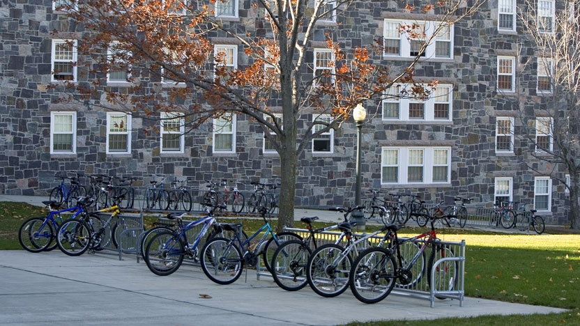 Bicycles on a rack outside a residence hall.