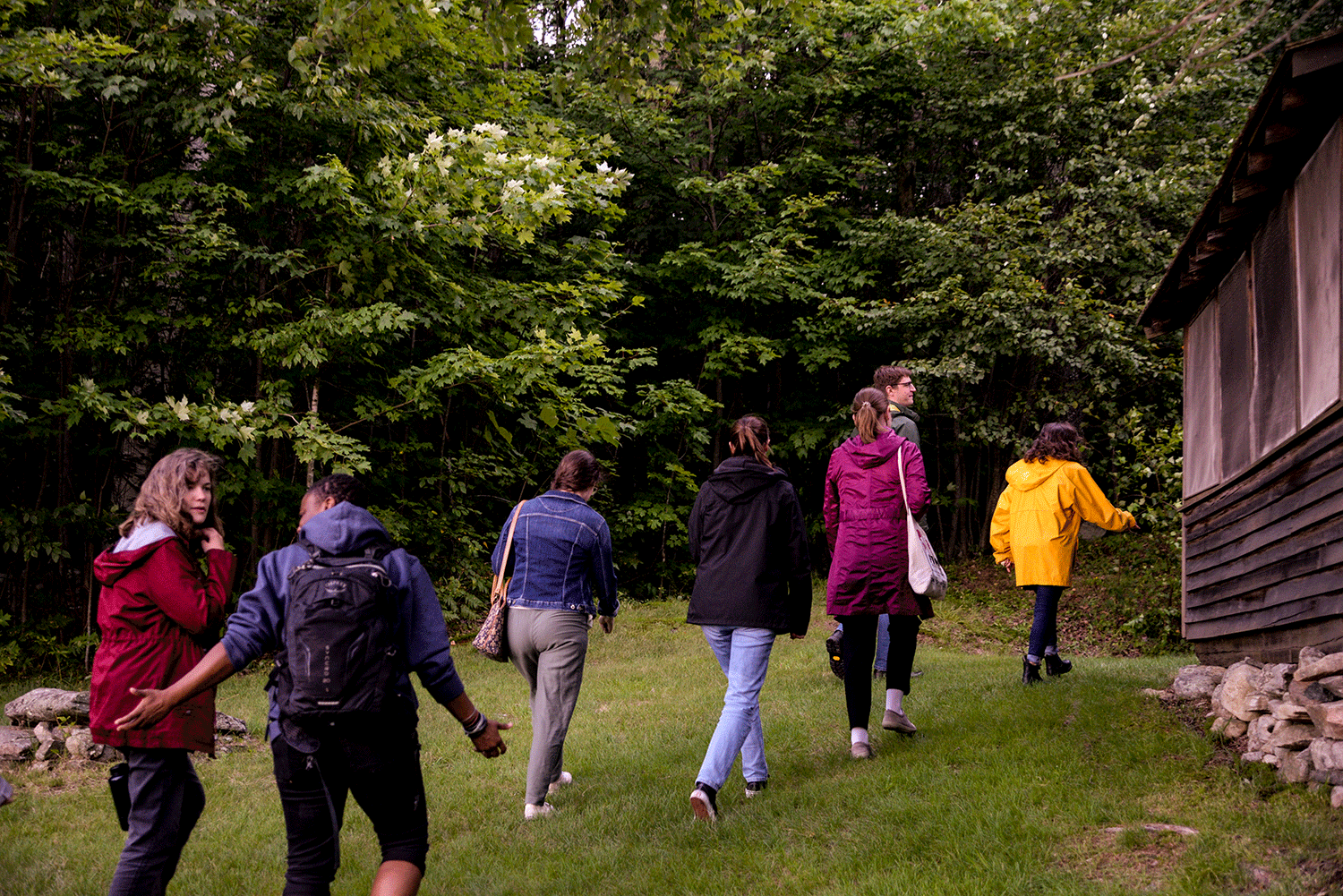 students walking towards Frost cabin
