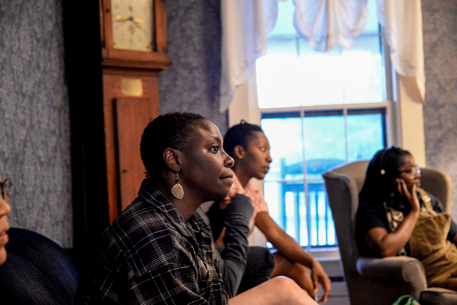 students in a meeting in Bread Loaf's blue parlor