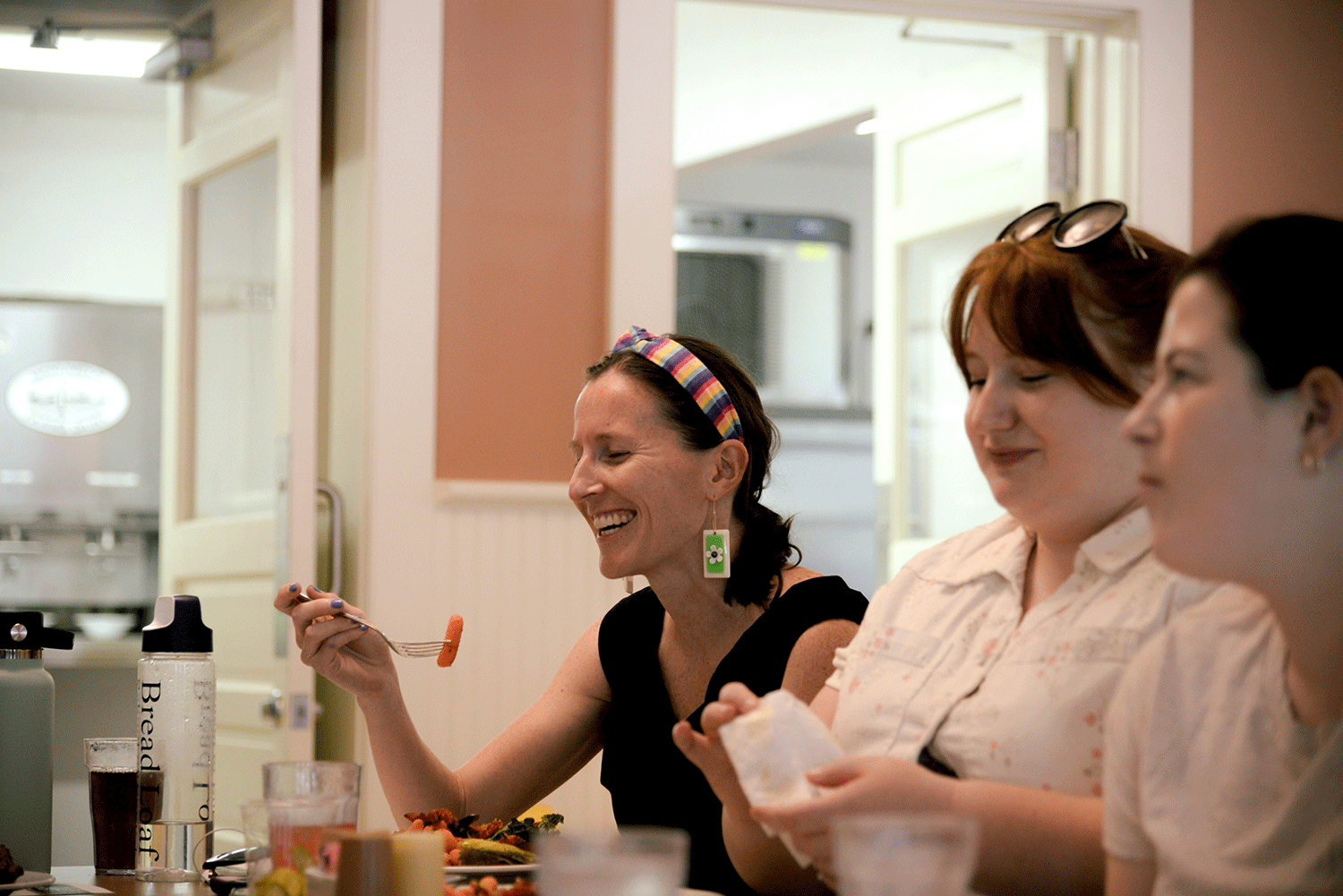 student eats lunch with friends