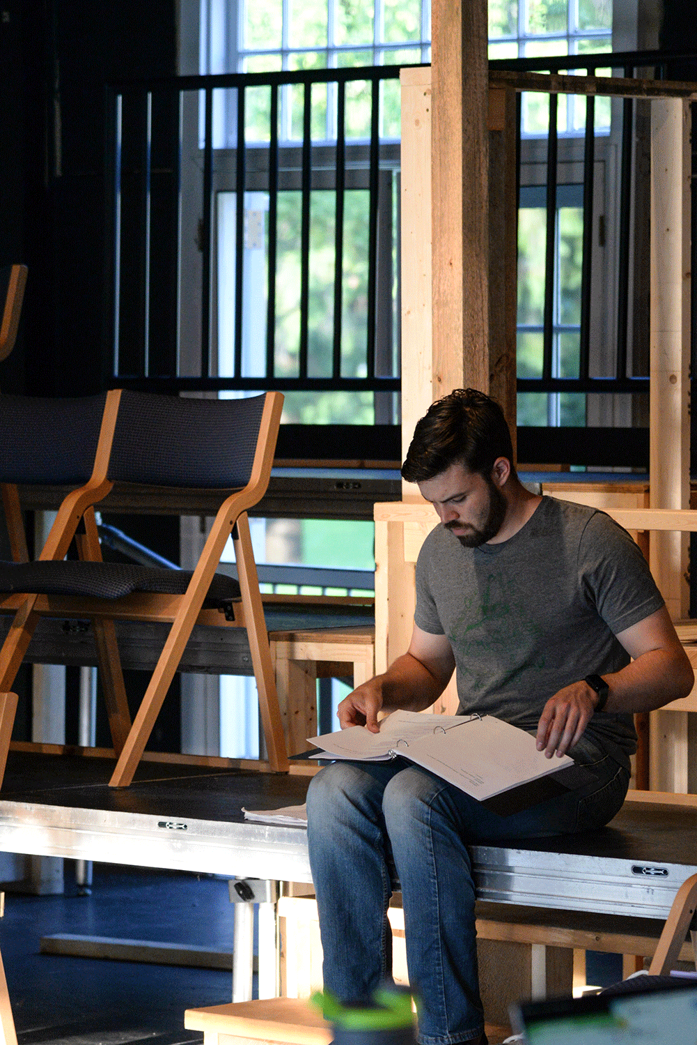 student reads script in Bread Loaf theater