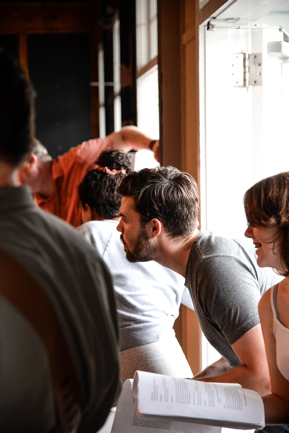 actors prepare to enter stage during a rehearsal