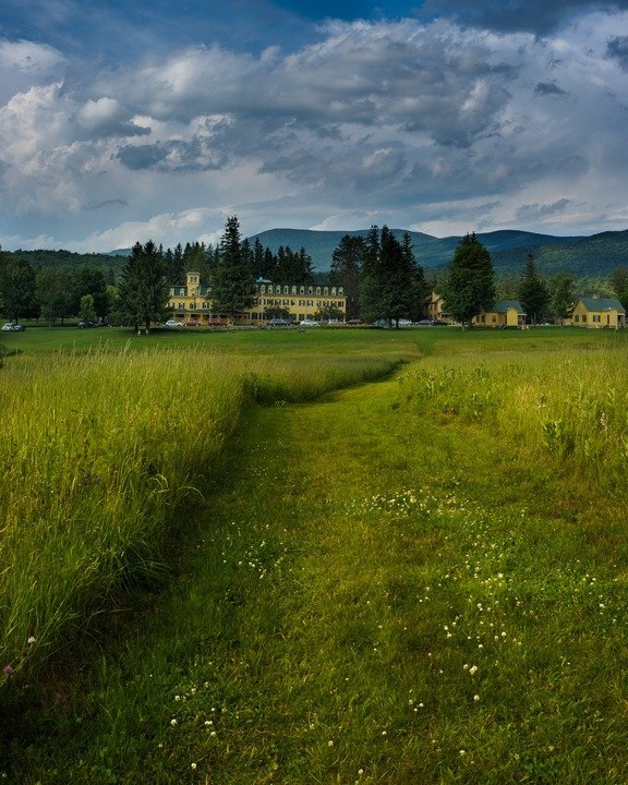 path through meadow to Bread Loaf campus