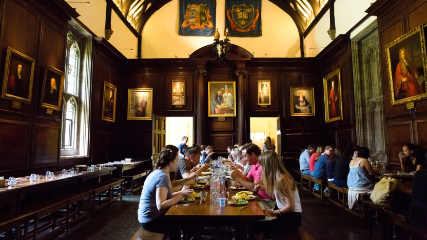 Students eating in dining hall on Oxford campus.