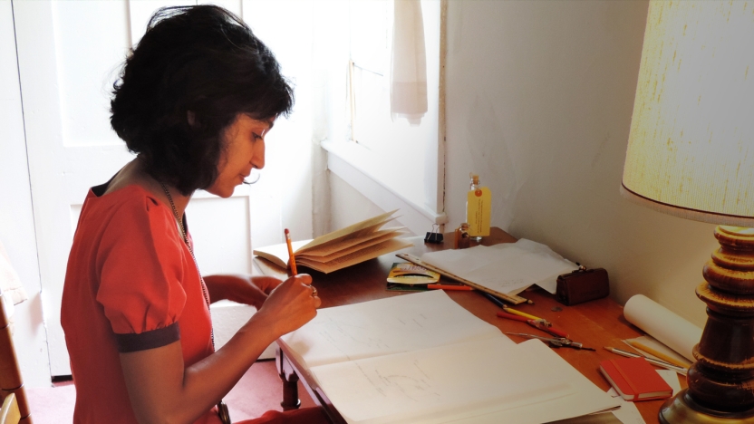Bread Loaf student Himali Singh Soin works at her desk.
