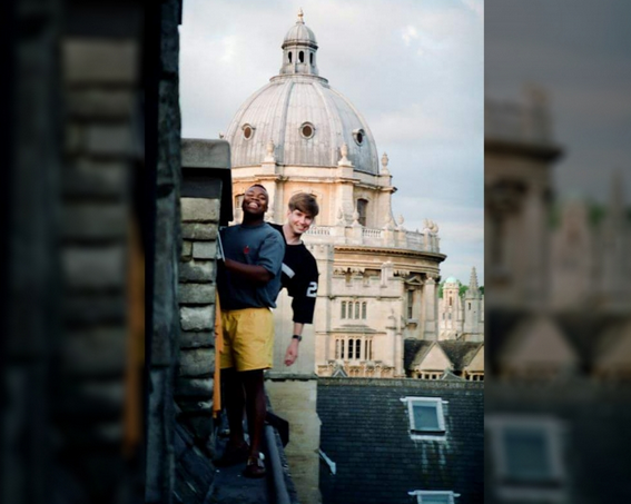 Two male BLSE students on a balcony in Oxford.