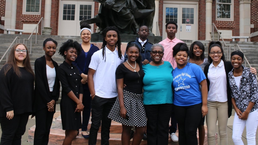 A group of BLTN NextGen students standing together posing for the camera.