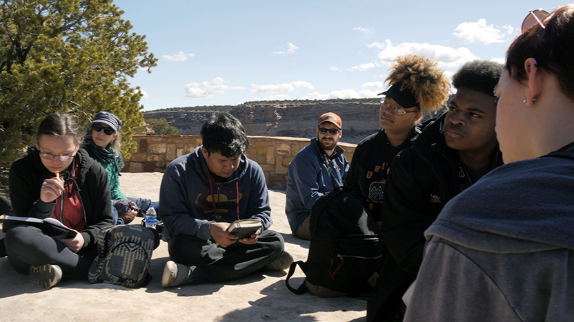 Seven BLTN students gather to learn outdoors.