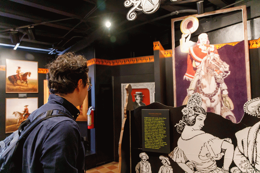 student at museum exhibit