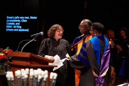 Three faculty stand at a podium at the graduation ceremony in Ripton, Vermont