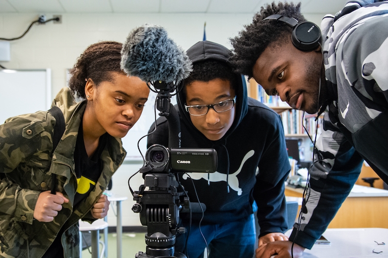 Young people from South Carolina filming during a visit from Vermont peers