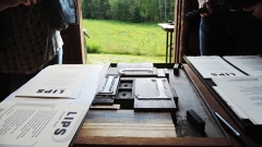 A photo of an old letterpress in a cabin on the BLSE Ripton campus.