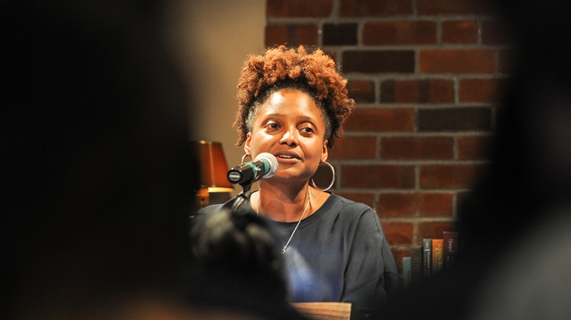Tracy K. Smith reads at a lectern