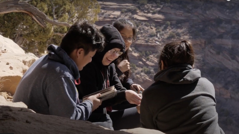 Four NextGen students get to know each other atop a mountain.
