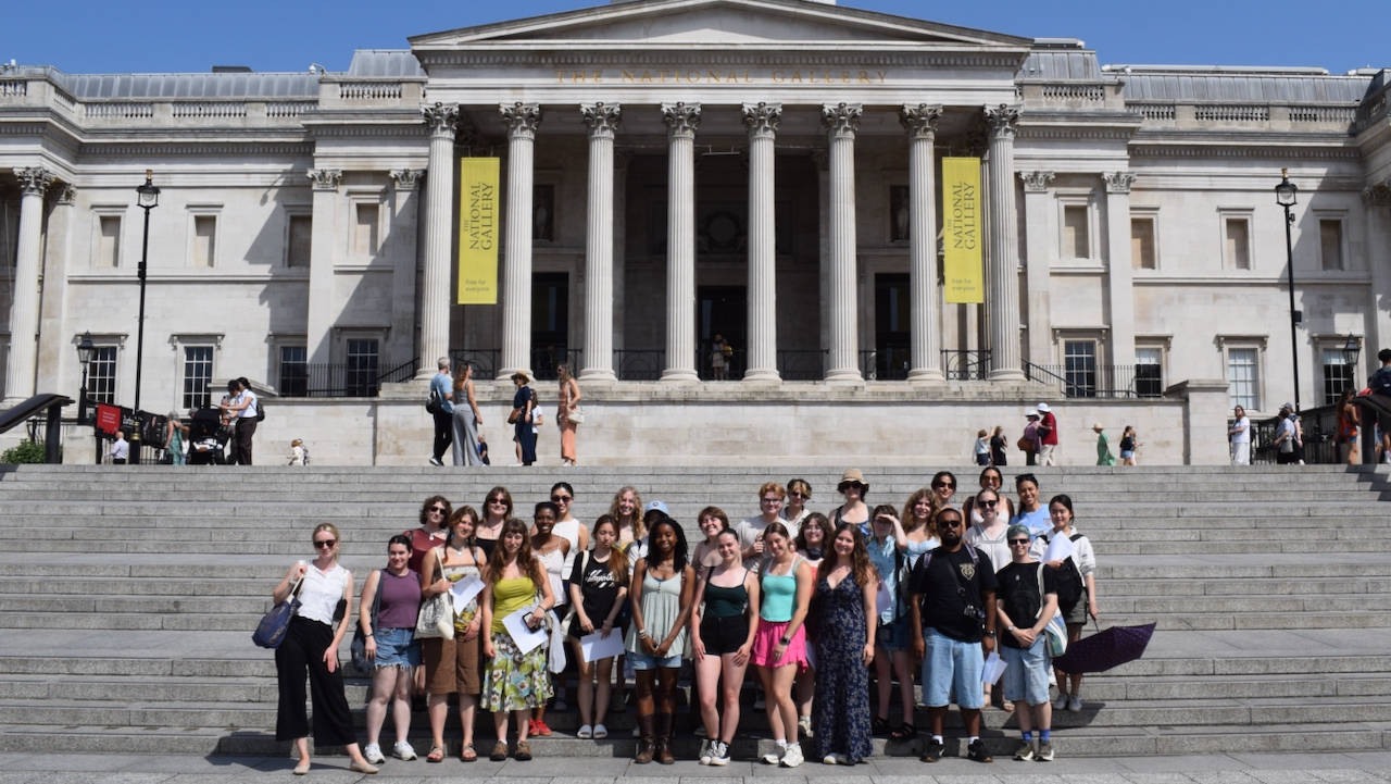 Museum Studies students stand on the steps outside the National Gallery in London on a sunny June day.
