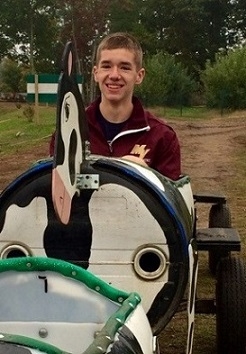 A student sits on a playground rocker