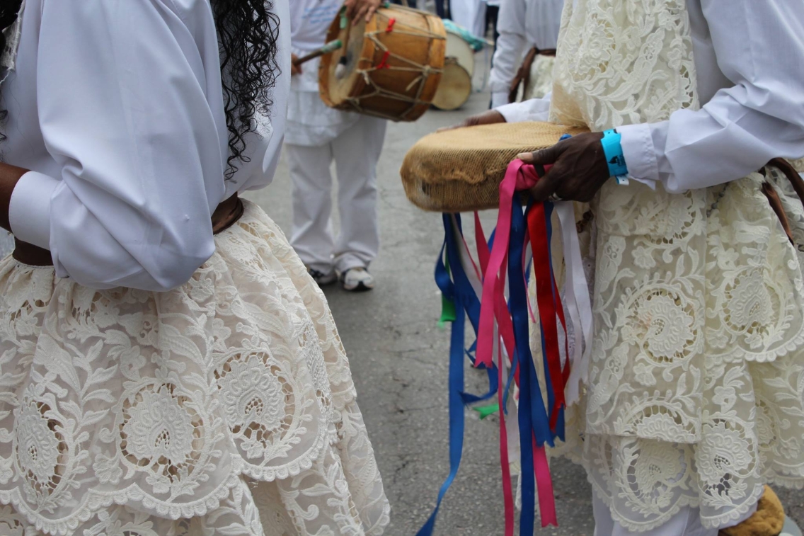 Poeple holding instruments for a traditional Afro-Brazilian dance
