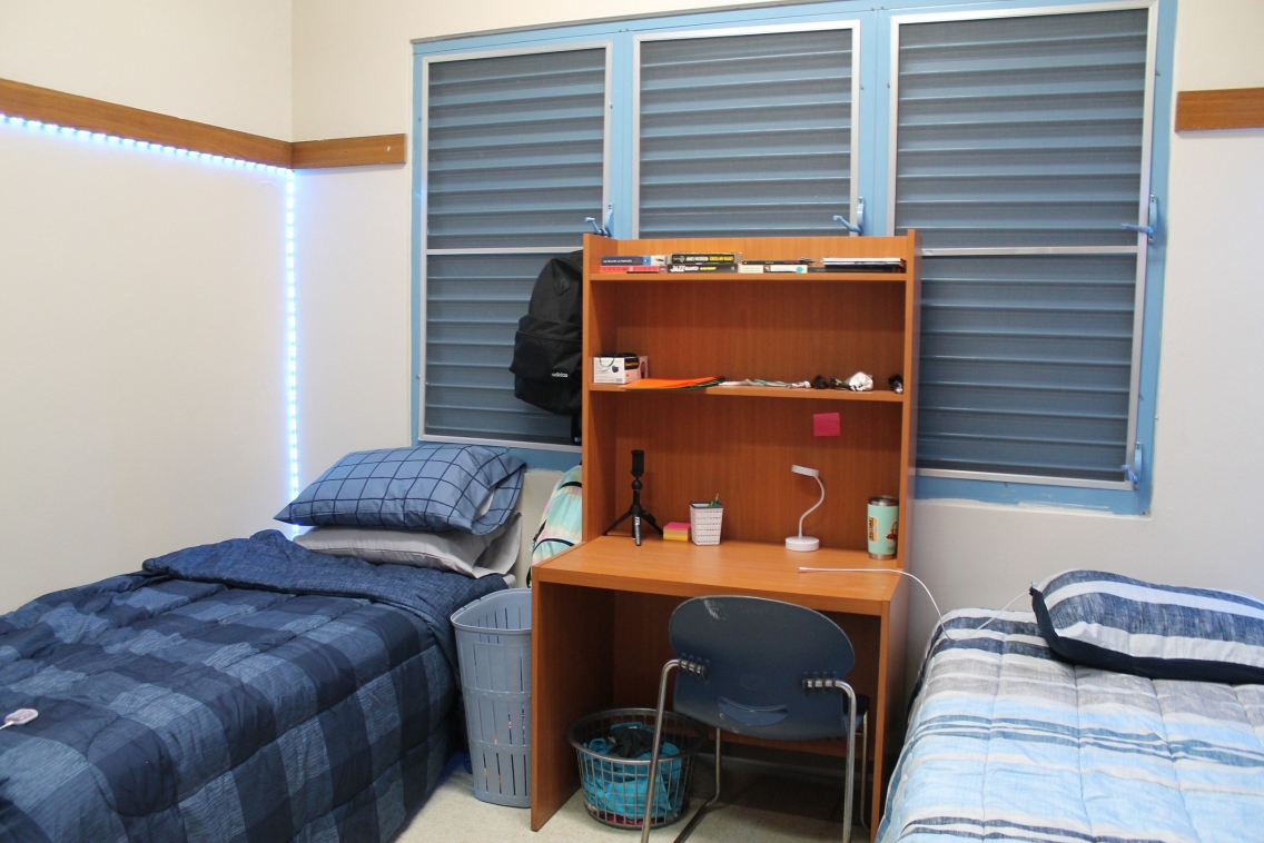 Two beds in a dorm room