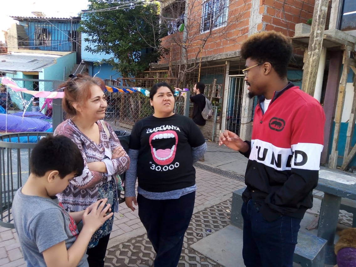 A student speaking with community members