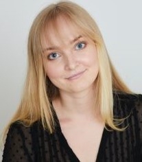 Blonde student with bangs smiling